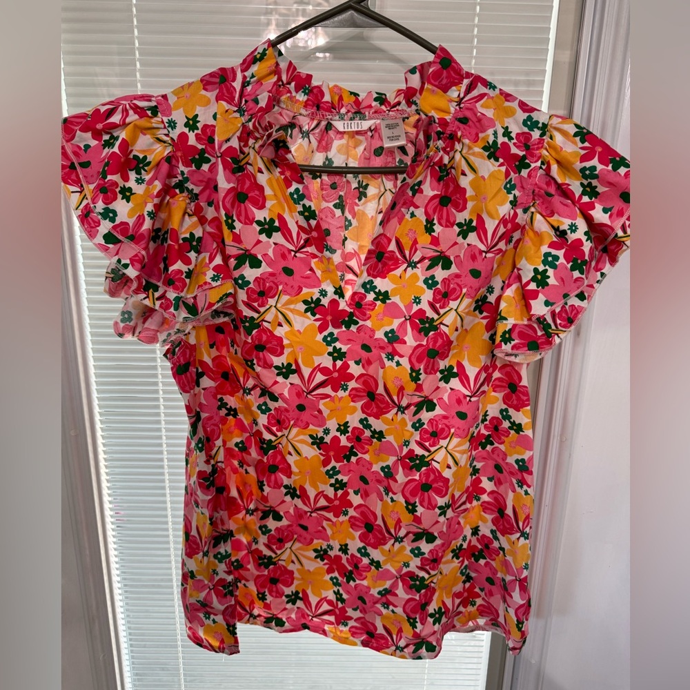 Floral Blouse with flutter sleeves.
